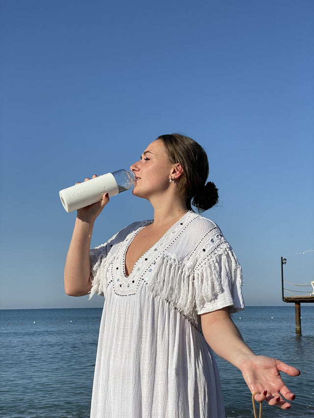 White bottle by the sea
