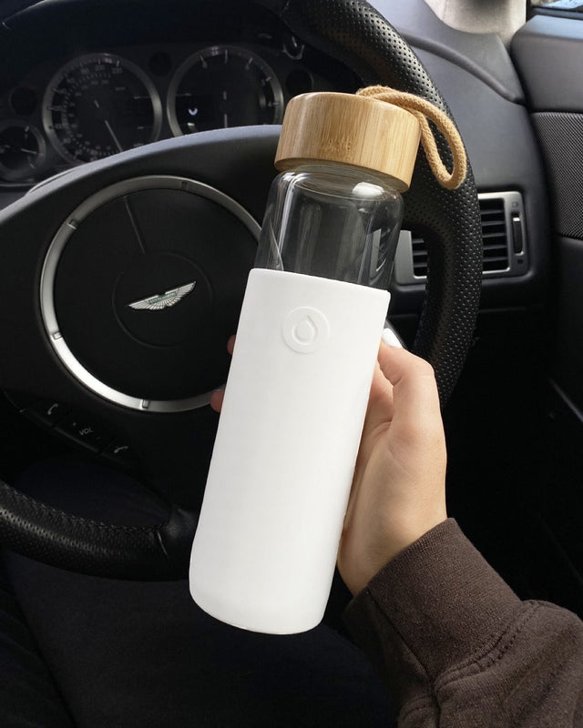 White bottle inside a car